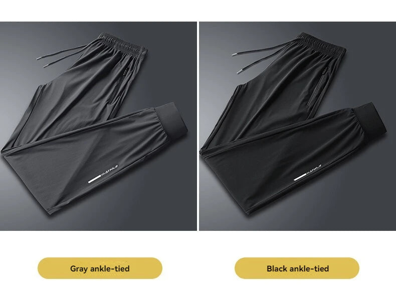 A pair of men's ice silk performance pants shown in gray and black, featuring ankle ties.