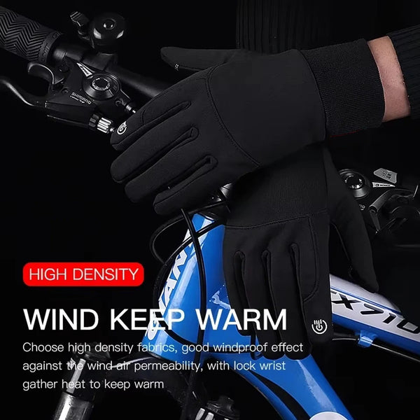 Black high-density cycling gloves being worn on a hand, with a blue bicycle visible in the background.