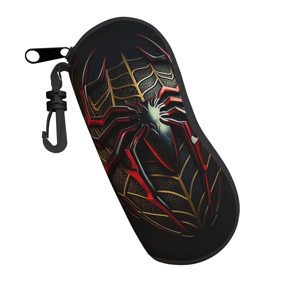 A black pouch featuring a detailed red and gold spider web design, attached by a black cord.