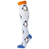 A pair of white compression socks featuring repeating black penguin patterns and orange cuffs.