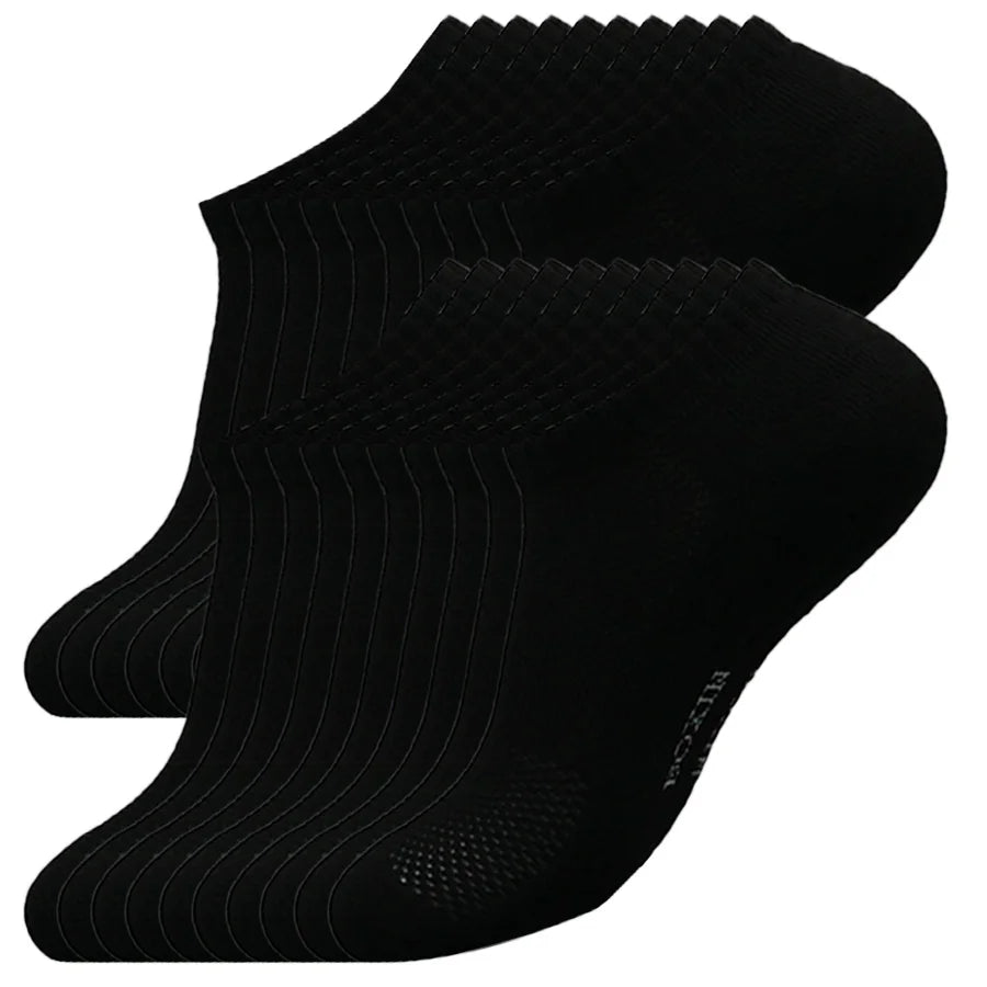 A set of black men's essential warm socks for outdoor activities, displayed in a stack.