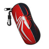 A red and black pouch featuring a white spider web design, attached with a black cord.