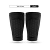 A set of two black honeycomb shin guards for football training.