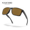 A pair of black sunglasses with brown lenses shown against a white background.