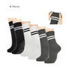 Six pairs of black and white grip socks for Pilates, yoga, and barre