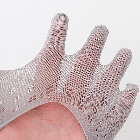 A close-up of a hand wearing a sheer, skin-toned silicone fingerless glove or sock.