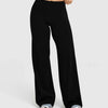 Black high waisted wide leg yoga pants worn by a person.