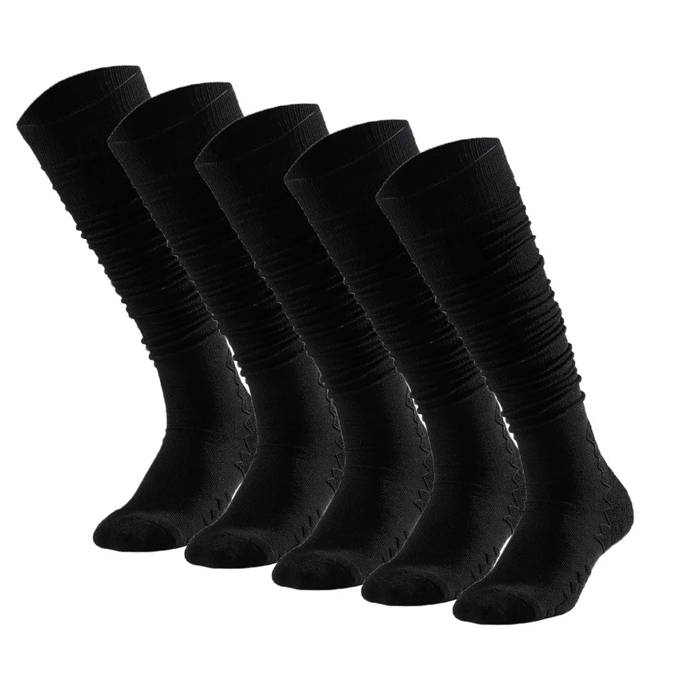 A row of black knee-high sports socks laid out flat.