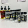 A collection of Walker Ultra Hold Lace Wig Glue bottles and applicators for hair systems.