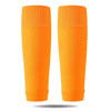 A pair of bright orange professional compression soccer and sports sleeves.