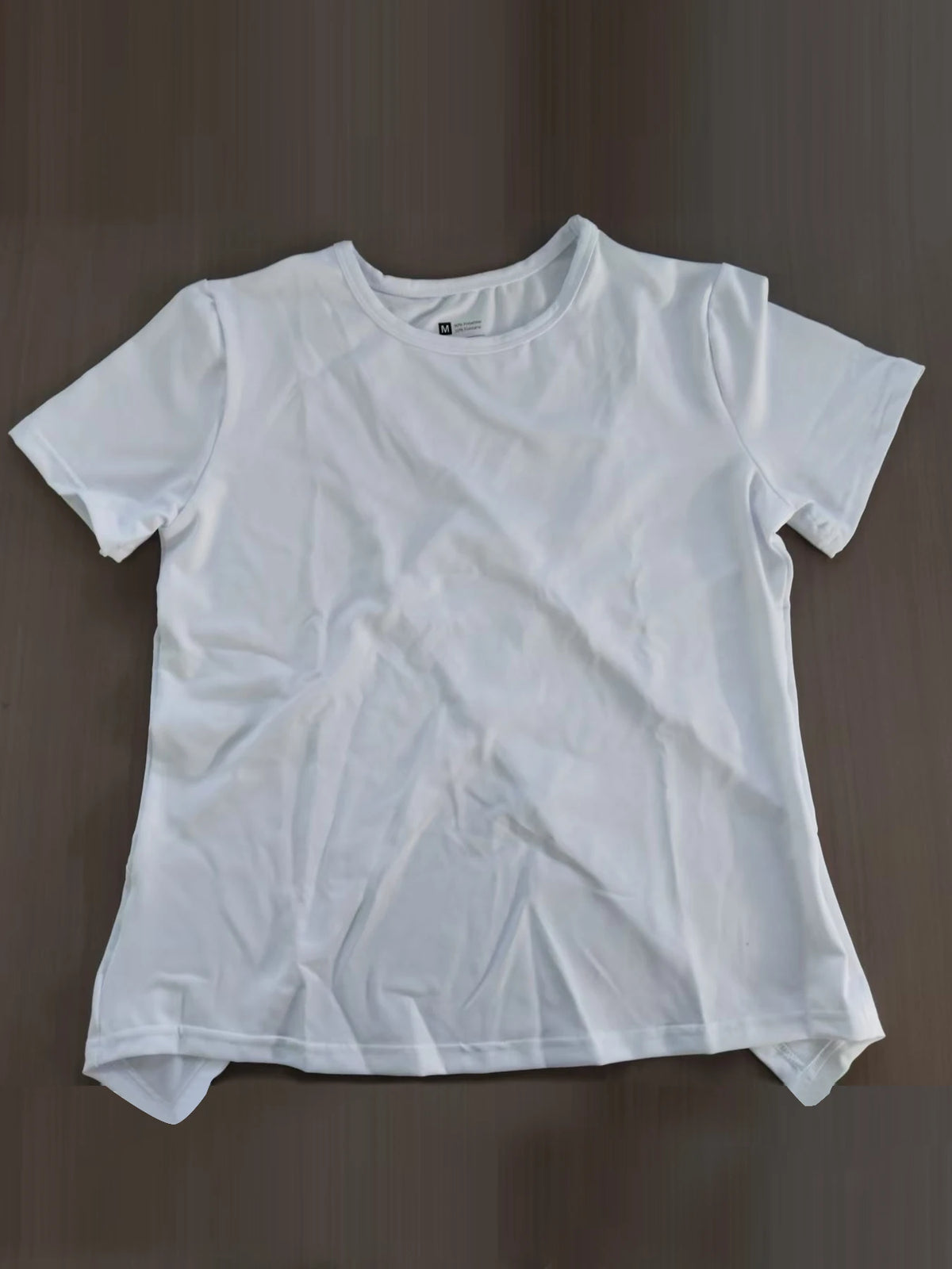 White women's breathable summer yoga and fitness t-shirt laid flat.