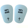 A pair of light blue soccer shin guards featuring the text 100% JESUS and a cross symbol.