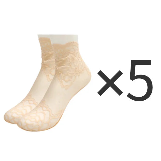Five pairs of beige lace mesh ankle socks displayed together.