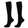 A pair of black medical grade compression socks for veins and circulation.