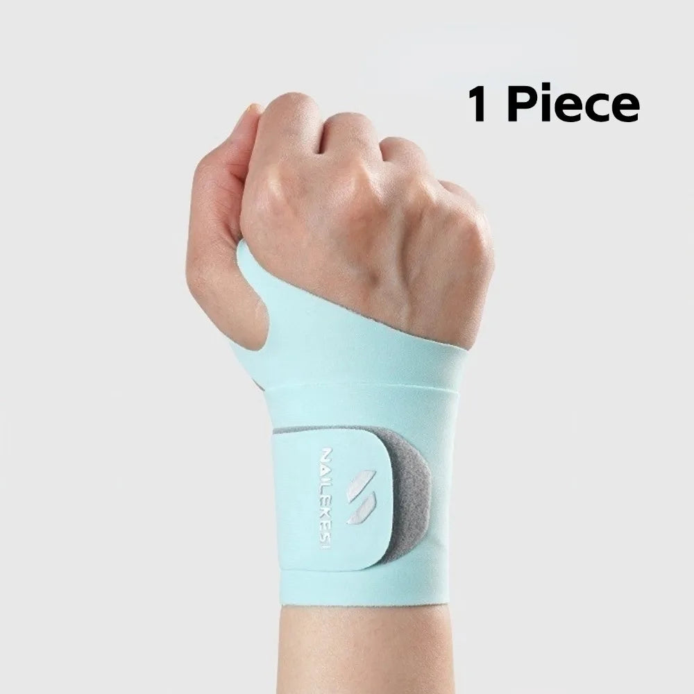 A light blue wrist compression brace is shown on a hand, with a gray insert visible.