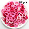 Haufen von 700 rosa und roten Nylon-Elastband-Haargummis für Pferdeschwänze und Zöpfe.