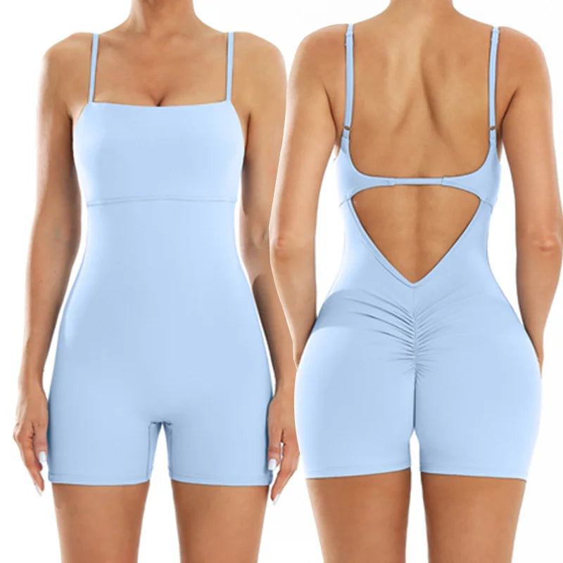 A woman models a light blue, backless fitness jumpsuit from the back and front views.