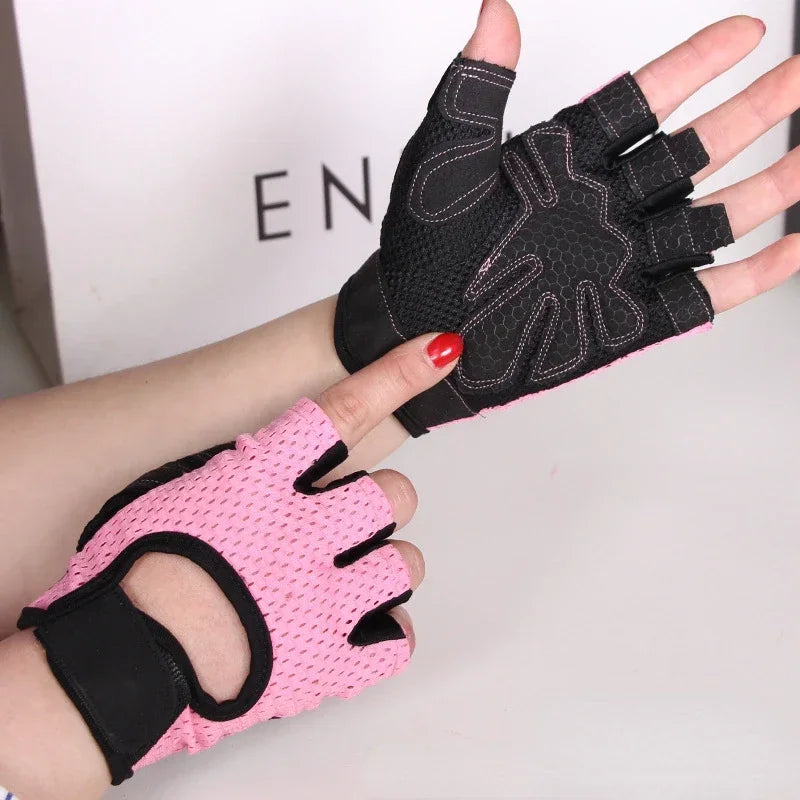 A hand wearing a pink anti-slip fingerless gym glove with black wrist support.