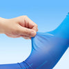 A hand is adjusting a blue dynamic breathable arm sleeve on a person's leg.