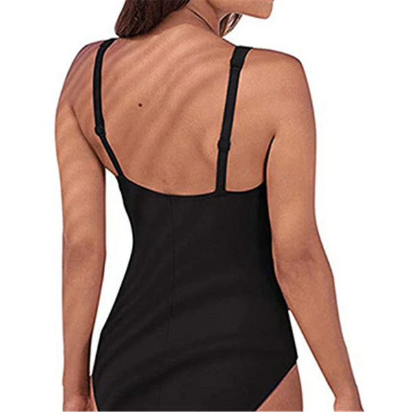 A woman wearing a black one-piece swimsuit from the back view.