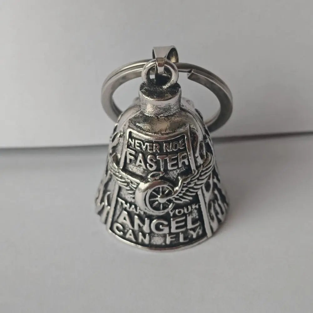 Silver bell pendant with a loop, engraved with 'NEVER KID FASTER' and 'YOUR ANGEL CAN FLY'.