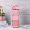 A pink protective water bottle sleeve features a clear bottle and a dedicated phone holder and key loop.