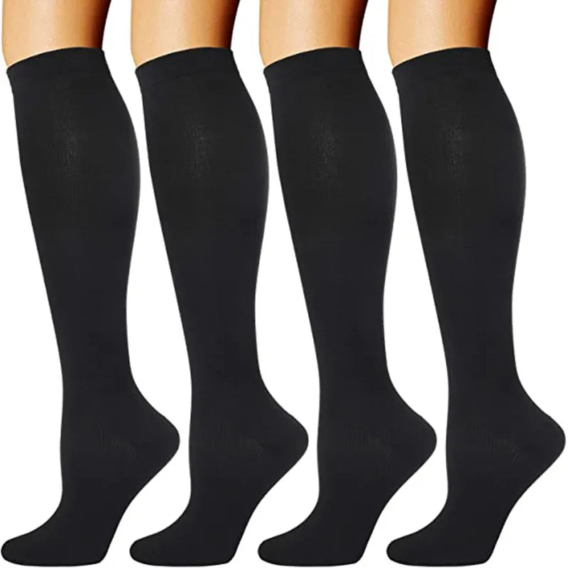A set of black medical grade compression socks for veins and circulation.