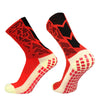 A pair of red and black anti-slip training socks shown from the side.