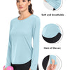 A woman models a light blue loose fit sun protection t-shirt with details showing its soft fabric, hem, and thumb holes.