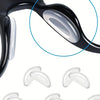 Close-up view of clear silicone anti-slip eyeglass nose pads for glasses frames.