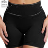Black high-rise knit fitness shorts worn by a person.