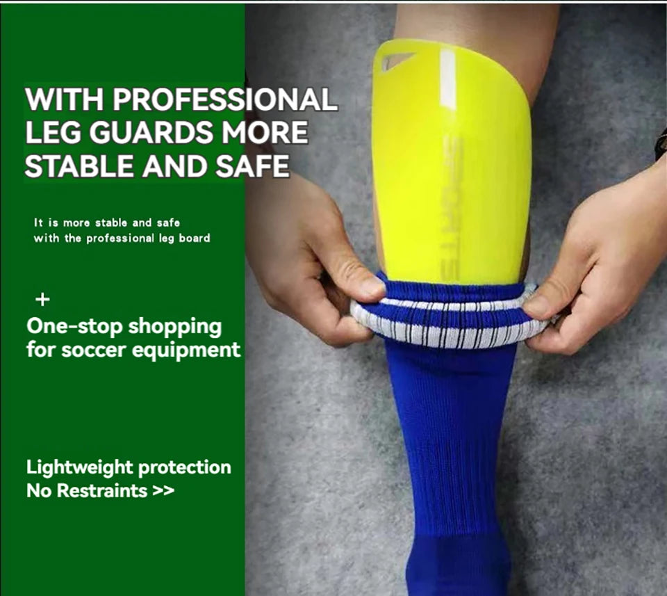 A hand is holding a bright yellow soccer leg guard on a person's lower leg.