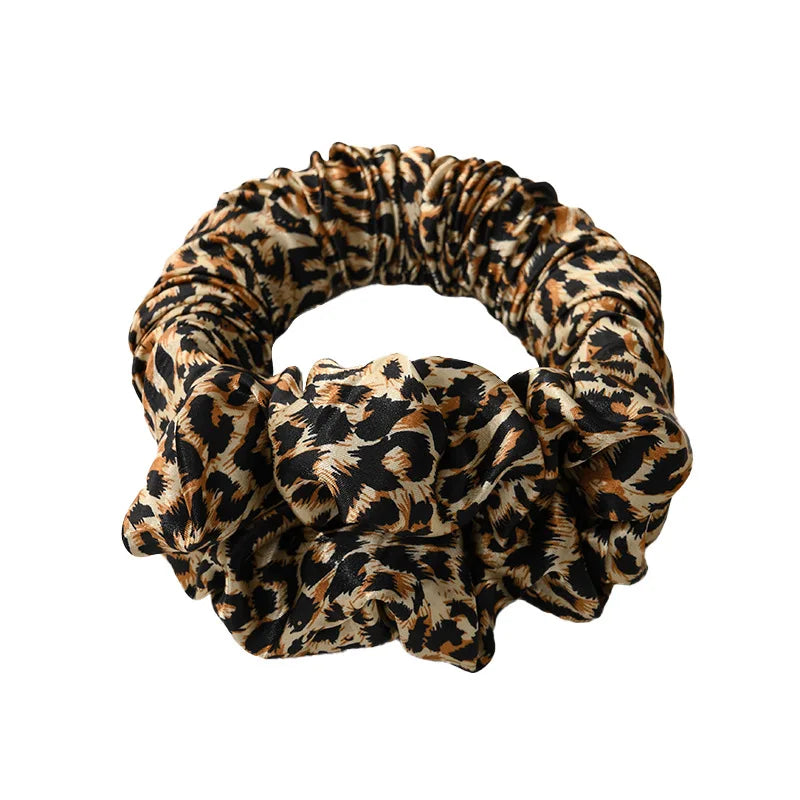 A black and brown leopard print heatless curling rod headband.