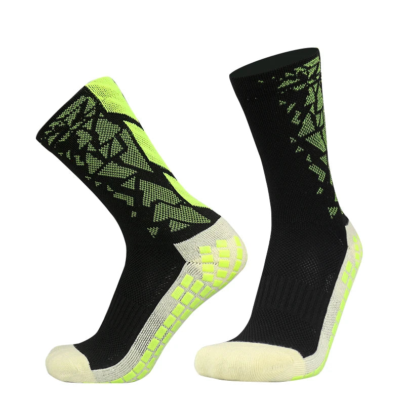 A pair of black and neon yellow anti-slip silicone football socks shown from the side.