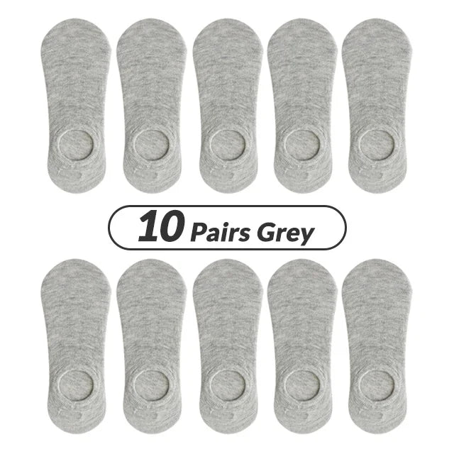 Ten pairs of grey men's invisible silicone no-show socks laid out for sale