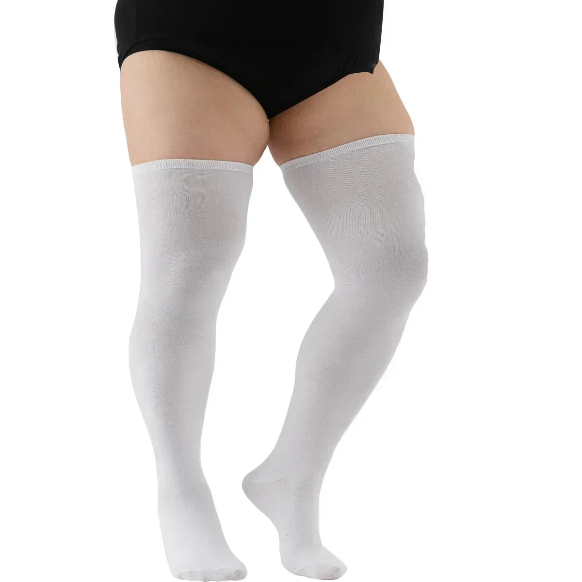 A pair of white thigh high leg warmers worn on a person's legs.