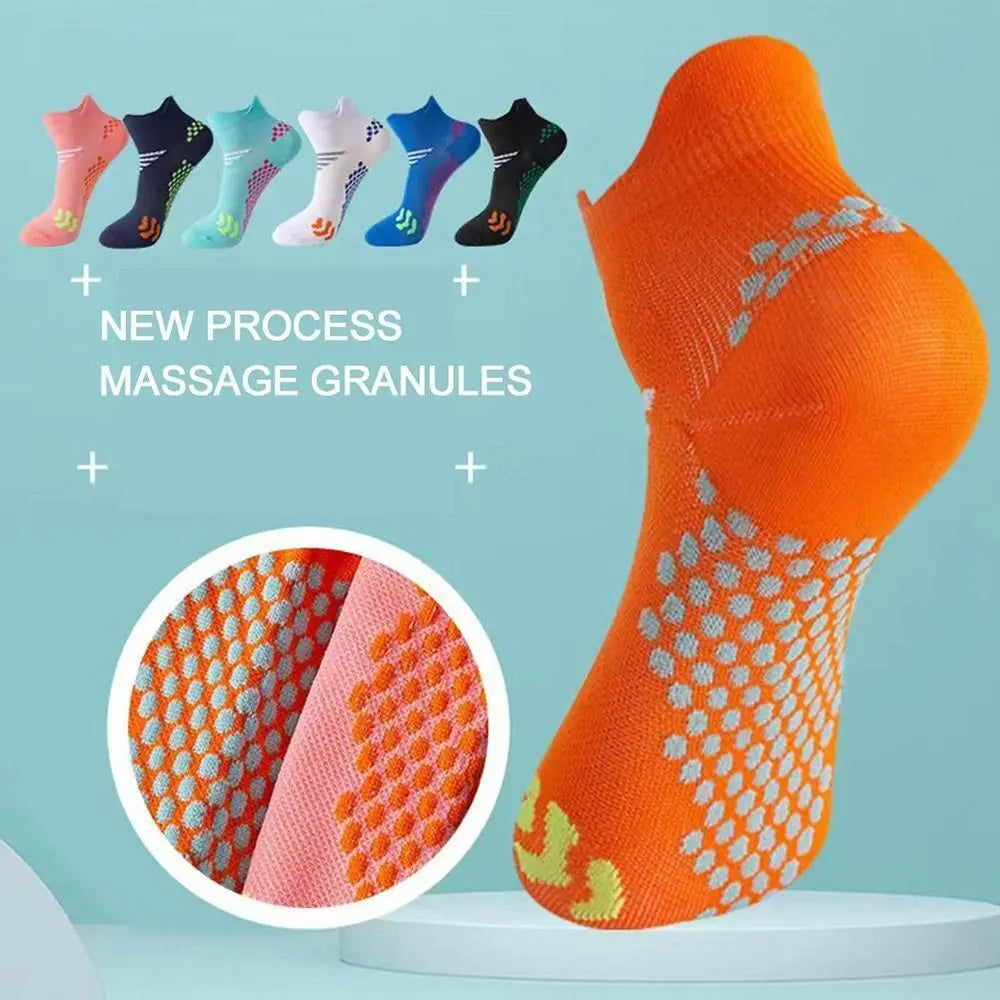 Orange compression socks with massage granules shown on a foot.