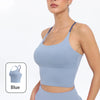 A model wearing a light blue summer strappy yoga sports bra top and matching bottoms.