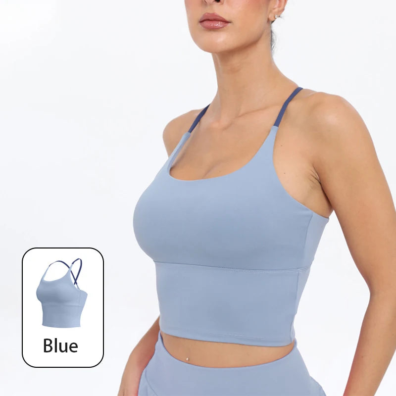 A model wearing a light blue summer strappy yoga sports bra top and matching bottoms.