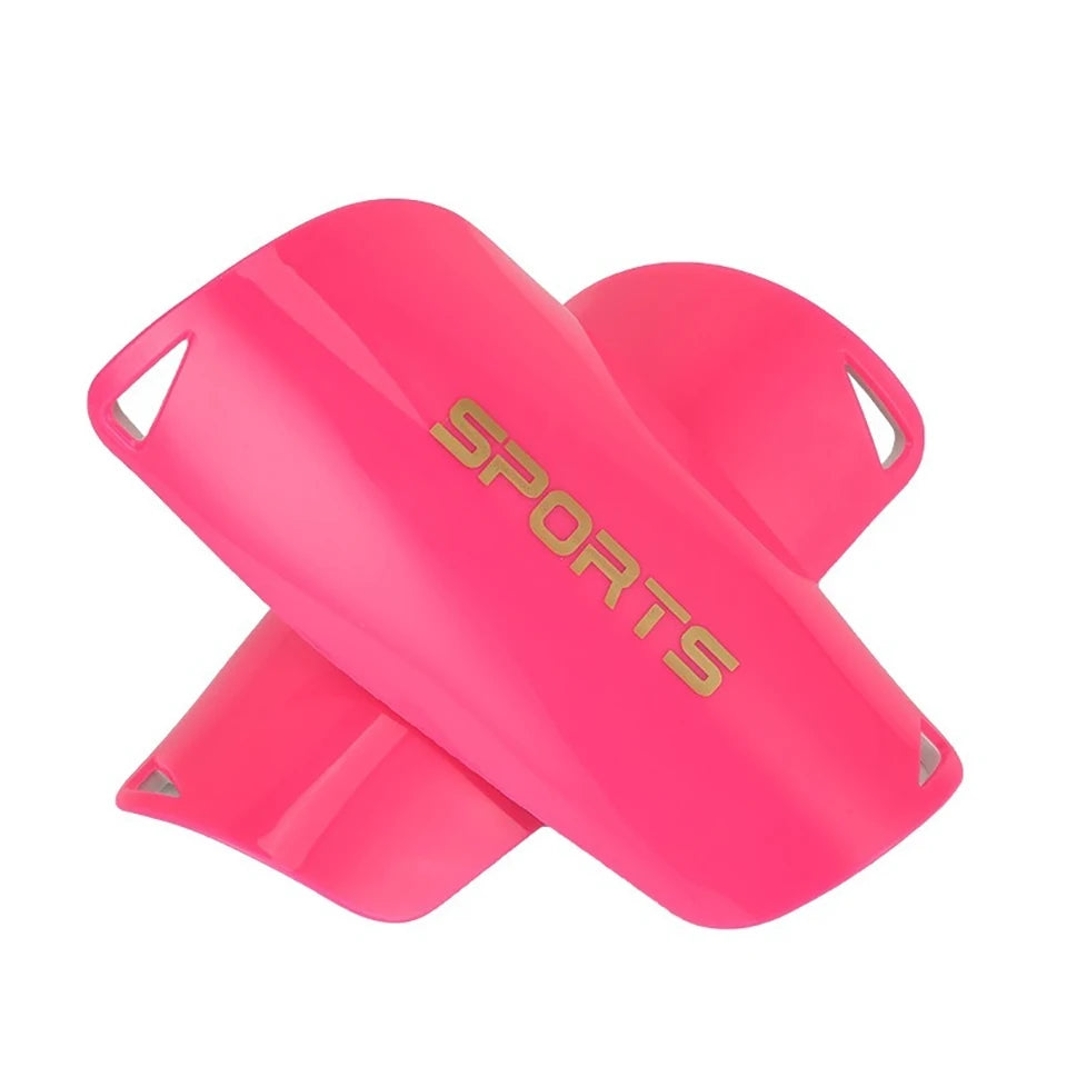 A bright pink durable soccer shin guard for a child, shown from the side.