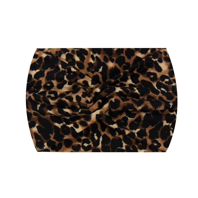 Bandeau de sport imprimé à l'élasticité avec motif léopard noir et marron.