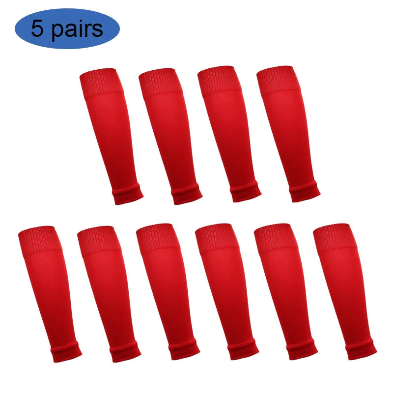 Five pairs of red football shin guards for leg protection