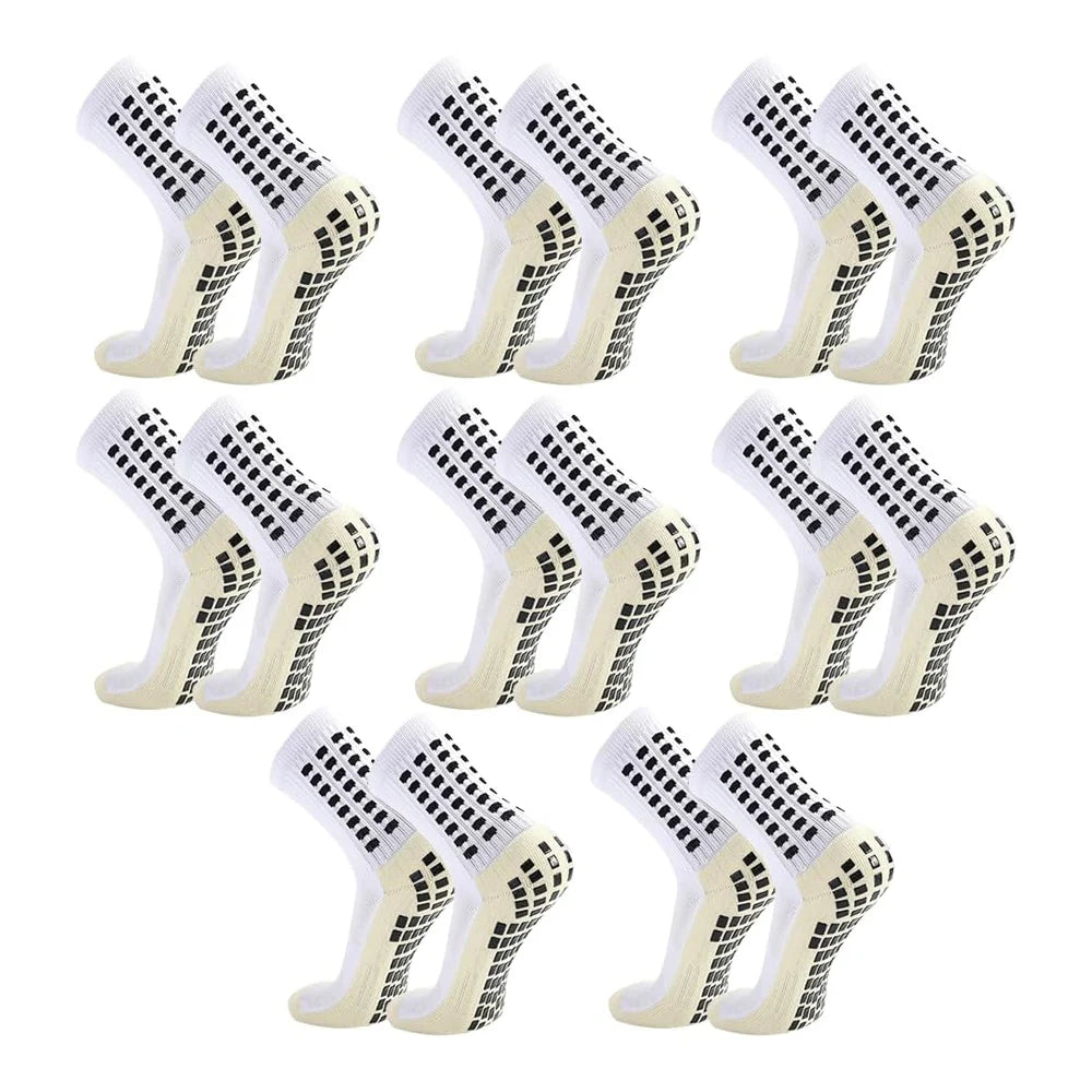 Acht Paar weiß-schwarz gemusterte rutschfeste Silikon-Fußsocken in einem Raster