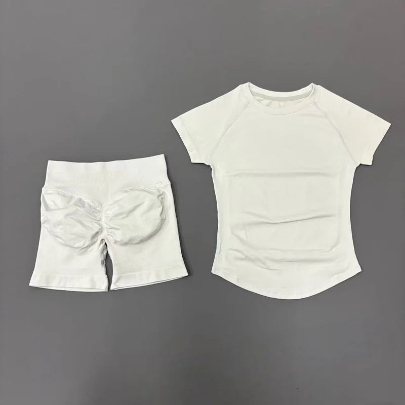 White seamless yoga set for women featuring a short sleeve top and workout leggings