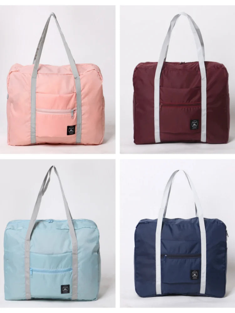 Three versions of a foldable travel duffel bag in pink, maroon, and blue fabric.