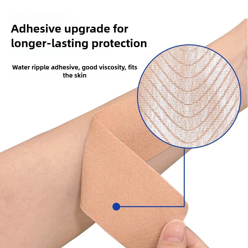 A hand applies adhesive upgrade kinesiology tape to the skin for protection and lifting.