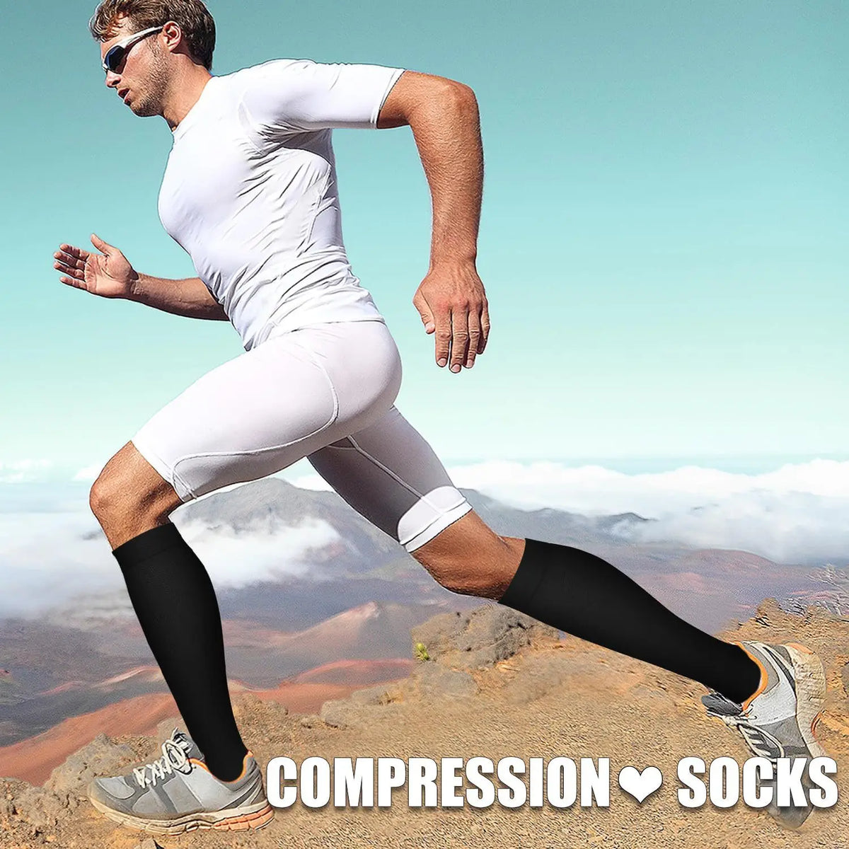 A man is running outdoors wearing compression socks and athletic clothing against a misty landscape background.