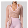 A model wearing a light pink long sleeve top and matching bottoms for a model showcase.