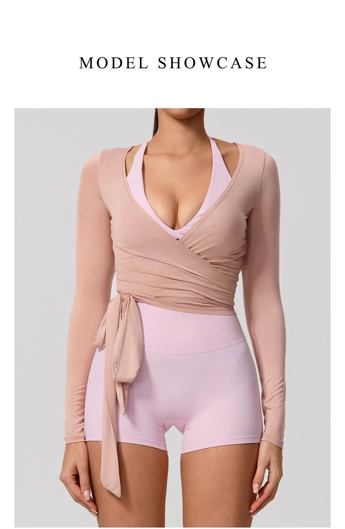 A model wearing a light pink long sleeve top and matching bottoms for a model showcase.