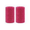 A pair of magenta dual sports wristbands for sweat absorption.